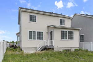 Back of house with stucco siding
