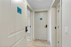 Hallway with light wood-type flooring