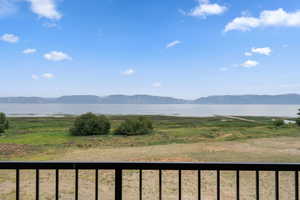 View of mountain backdrop featuring a nearby body of water