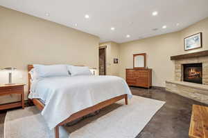 Large primary bedroom with fireplace