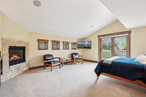 Guest suite or primary bedroom with wet bar and fireplace