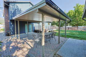 View of patio featuring outdoor dining space and a deck