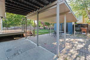 View of patio / terrace with outdoor dining area and a deck