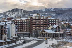 Snow covered building with a mountain view