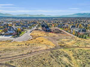 Aerial perspective of suburban area with a mountain backdrop
