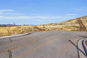 View of asphalt road featuring a mountain view