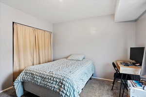 Bedroom with carpet and baseboards