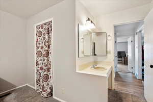 Bathroom with baseboards and vanity