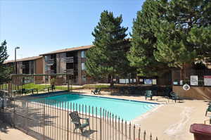 Community pool featuring a patio area