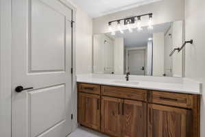Bathroom with vanity and light tile patterned floors