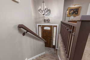 Foyer featuring a chandelier