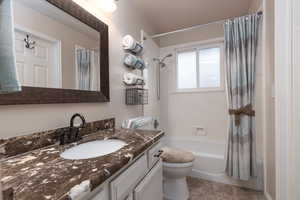 Full bath featuring shower / bath combination