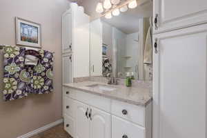 Full bathroom with jetted tub and a shower
