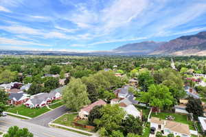 Aerial perspective of suburban area featuring a mountainous background
