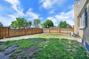 View of yard with central AC unit