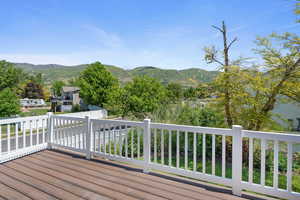 Wooden terrace featuring a mountain view