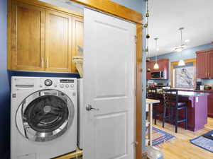 Washroom with washer / dryer, cabinet space. Each unit has it's own W/D