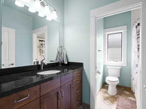 Full bath with vanity and toilet