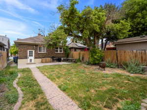 View of yard with a patio area and a fenced backyard