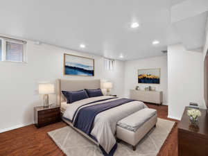 Bedroom featuring baseboards, wood finished floors, and recessed lighting