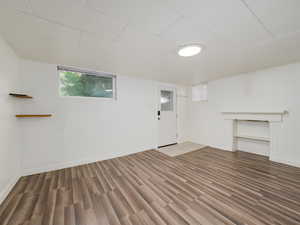 Basement with wood finished floors and baseboards