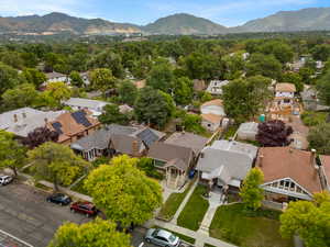 Birds eye view of property with a residential view and a mountain view