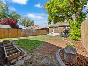 View of yard with a patio