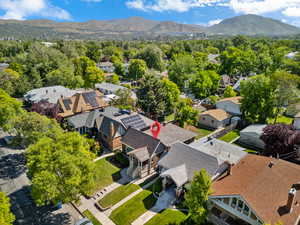 Aerial perspective of suburban area featuring a mountain backdrop