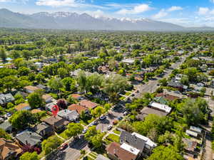 Aerial perspective of suburban area featuring a mountainous background