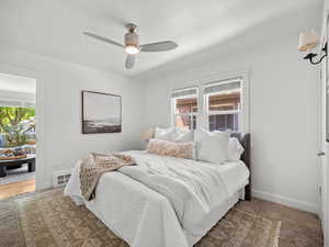 Bedroom featuring baseboards and ceiling fan