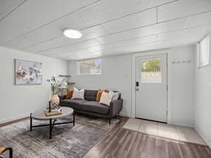 Living area featuring wood finished floors and healthy amount of natural light