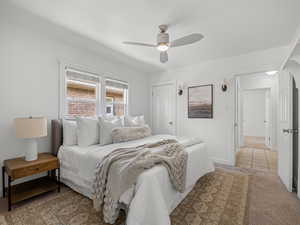 Bedroom with light carpet and ceiling fan