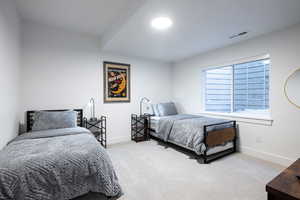 Bedroom with carpet and baseboards