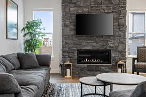 Living area featuring wood finished floors and a fireplace