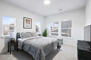 Bedroom with carpet floors and baseboards