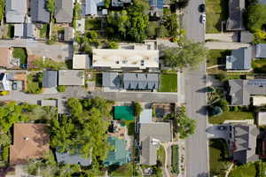 Aerial view of property's location with nearby suburban area