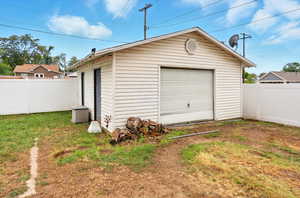 Detached garage featuring driveway