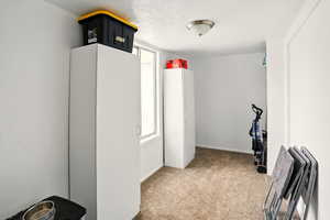 Workout area with carpet floors and baseboards