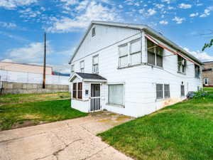 View of front of house with a front lawn