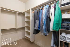 Walk in closet featuring carpet floors