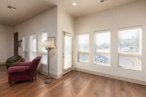 Sitting room featuring wood-type flooring and recessed lighting