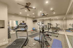 Gym featuring ceiling fan and recessed lighting