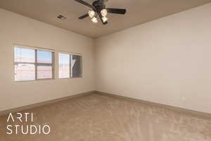 Empty room with light carpet, baseboards, and ceiling fan