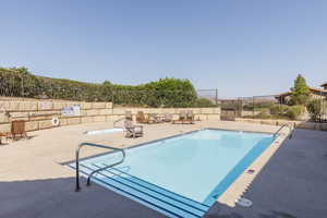 Community pool featuring a patio area