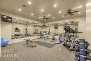 Gym featuring recessed lighting, carpet, and ceiling fan