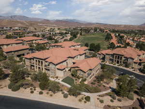 View of property location with a mountain backdrop and nearby suburban area