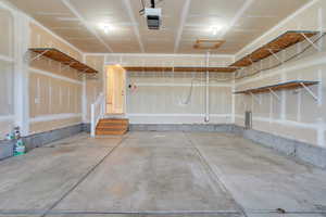 Garage featuring a garage door opener