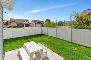 View of yard with a residential view and a patio