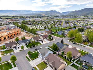 Aerial view of residential area featuring a mountainous background