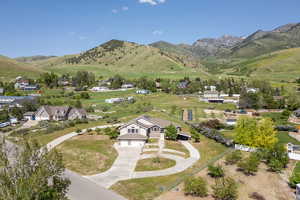 Aerial perspective of suburban area with a mountain backdrop